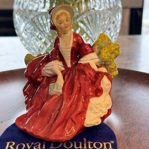 Royal Doulton miniature figurine "Lydia" HN 1808. Girl sitting in a garden.